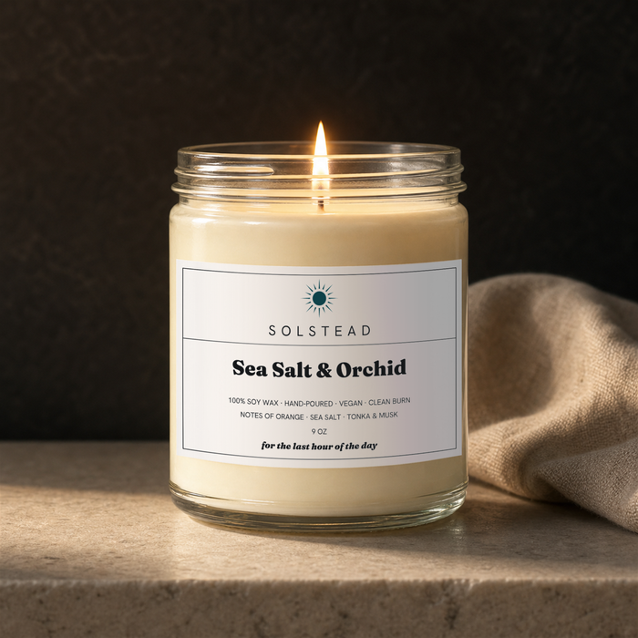 Sea Salt & Orchid 9 oz soy candle lit and burning — Solstead